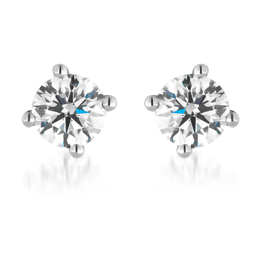 Introducing the Raffi&Co.® 18K White Gold Diamond Stud Earrings, featuring a luxurious round brilliant diamond set in a four-prong white metal setting against a pristine background. These exquisite earrings shine with clarity, embodying timeless elegance and sophistication.