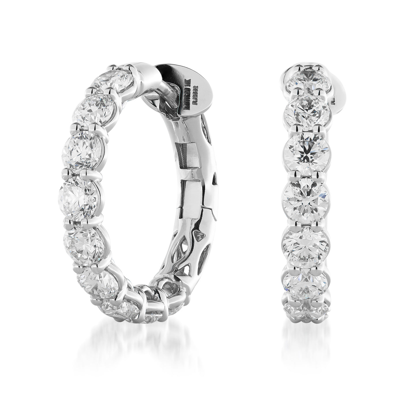 The Raffi&Co.® 14K White Gold Diamond Hoop Earrings are exquisitely crafted and adorned with brilliant round-cut diamonds. Featuring a seamless arrangement of stones, these elegantly designed earrings exude luxury and sophistication.