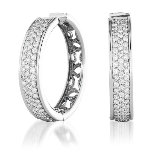 A pair of Raffi&Co.® handcrafted hoop earrings in 14K white gold, embellished with pavé-set diamonds. One earring is displayed front-on, revealing the detailed diamond rows characteristic of the Raffi&Co® White Gold Diamond Hoop Earrings, while the other is shown from the side, accentuating its circular shape and intricate inner design.
