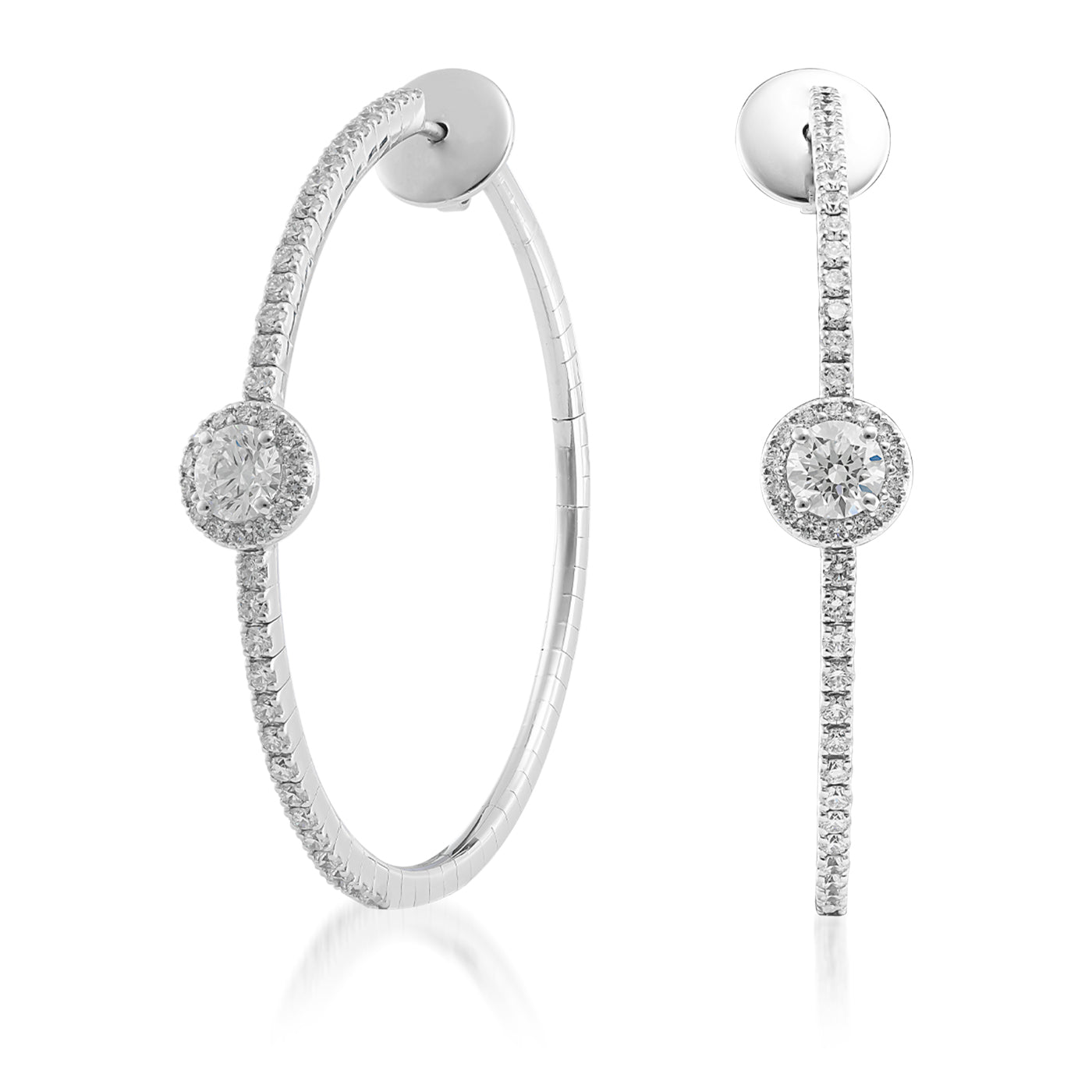 The Raffi&Co.® 14K White Gold Diamond Hoop Earrings are a pair of luxury earrings crafted by Raffi&Co, featuring small diamonds encrusted along the hoops and a larger round diamond at the center. They boast a smooth, polished finish that adds an elegant touch to any ensemble.