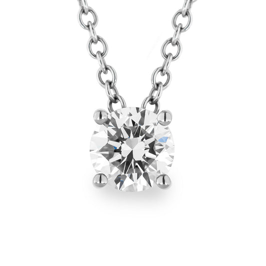 Experience timeless elegance with this close-up of the Raffi&Co.® 14K White Gold Diamond Pendant Necklace, featuring a round-cut diamond in a four-prong setting. The finely linked chain beautifully emphasizes the central gemstone's brilliance, embodying understated luxury against a plain background that accentuates its exquisite design.