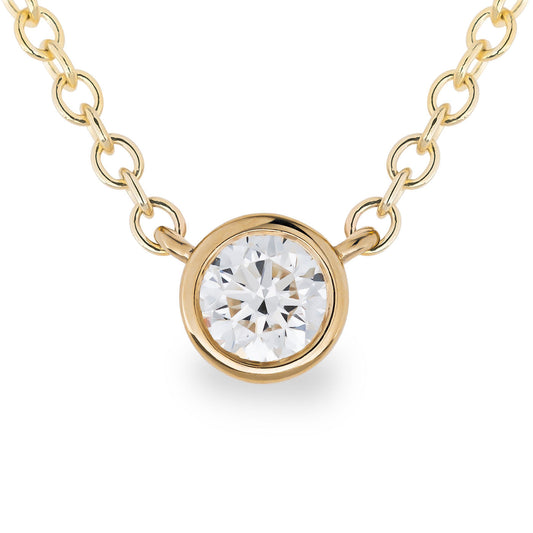 The Raffi&Co.® 14K Yellow Gold Solitaire Diamond Pendant Necklace is a minimalist piece that features a solitaire diamond elegantly set at its center. The design emphasizes the brilliance of the gemstone, with a plain white background enhancing its intricate details.