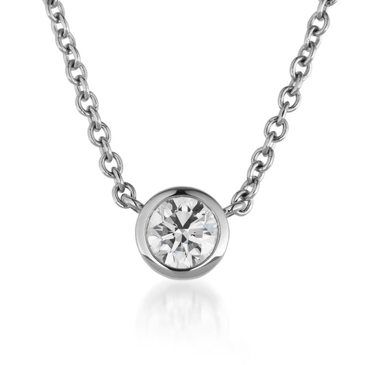 Introducing the Raffi&Co.® Signature Collection: a stunning 14K White Gold Solitaire Diamond Pendant Necklace featuring an exquisite solitaire diamond in a bezel setting. Crafted with the timeless elegance of white gold, this pendant stands out beautifully against a pristine white backdrop.