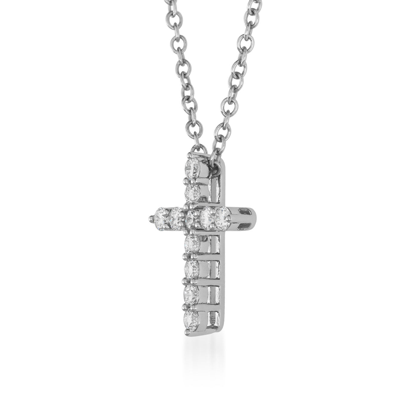 Discover the sophistication of the Raffi&Co.® 14K White Gold Diamond Cross Necklace Pendant. This exquisite piece from Raffi&Co features sparkling diamonds, beautifully set in a pendant that hangs elegantly from a simple chain against a plain white backdrop.