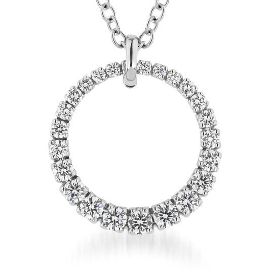 The Raffi&Co.® 18K White Gold Diamond Pendant Necklace showcases a circle design adorned with dazzling diamonds, elegantly hanging from a delicate chain. The equally spaced round stones enhance its symbolic allure against a plain white backdrop.