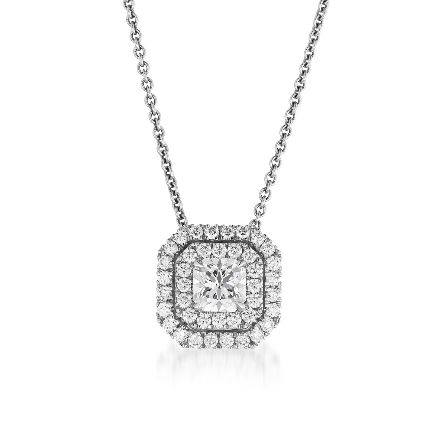 Introducing the Raffi&Co.® 14K White Gold Diamond Pendant Necklace, a luxurious piece by Raffi&Co. This exquisite pendant showcases a square-shaped design with a brilliant round center stone, elegantly framed by two layers of smaller diamonds for a captivating sparkle. The pendant gracefully hangs from a delicate chain, offering an elegant touch to any ensemble.