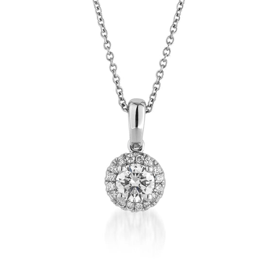 The Raffi&Co.® 14K White Gold Lab Grown Diamond Pendant Necklace exudes sustainable luxury with its stunning round pendant. It features a prominent central lab-grown diamond elegantly surrounded by a halo of smaller diamonds, all set in a pristine 14K white gold finish. The simple link chain enhances the refined elegance of this exquisite piece.