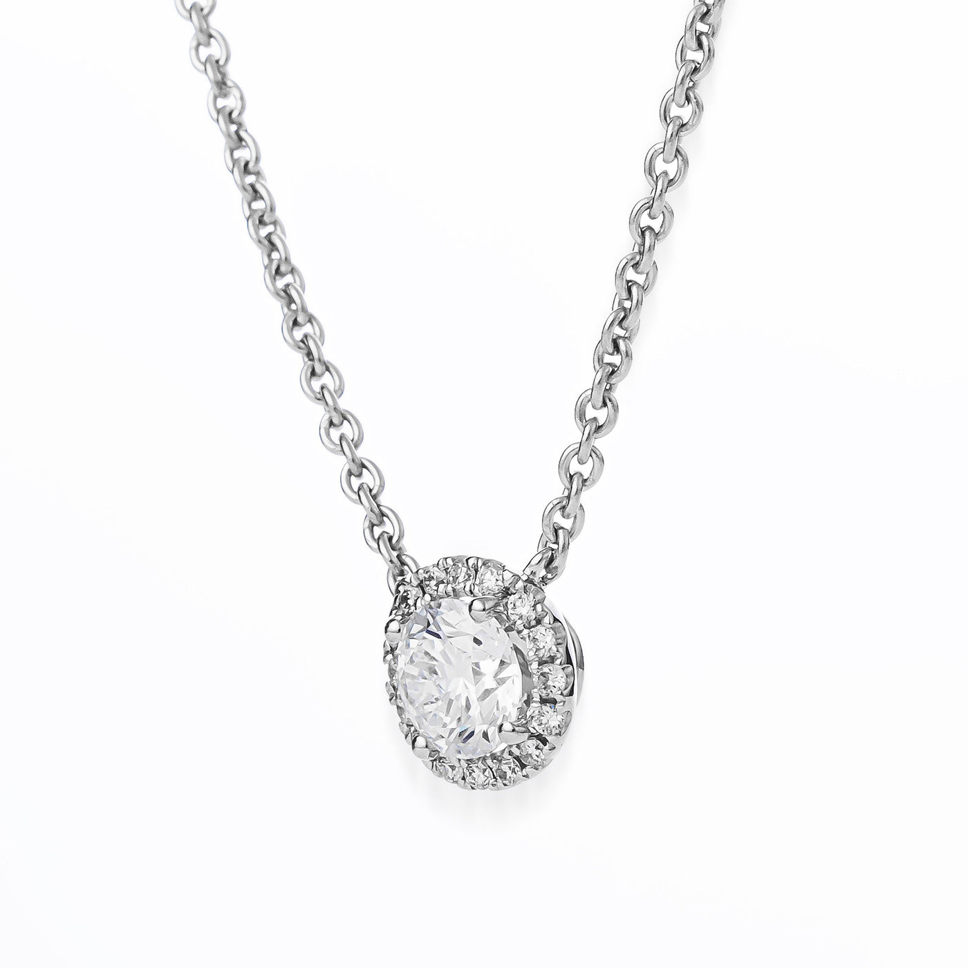 The Raffi&Co.® 14K White Gold Round Brilliant Lab Diamond Necklace Pendant features a central round brilliant lab diamond encircled by smaller diamonds in a dazzling halo design, set against a simple white background.