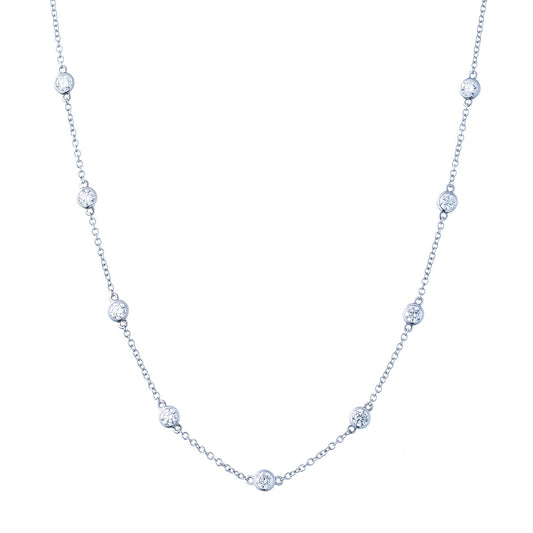 The Raffi&Co.® 14K White Gold Round Brilliant Diamond Station Necklace features a minimalist design with evenly spaced, bezel-set diamond-like stones along its delicate chain.