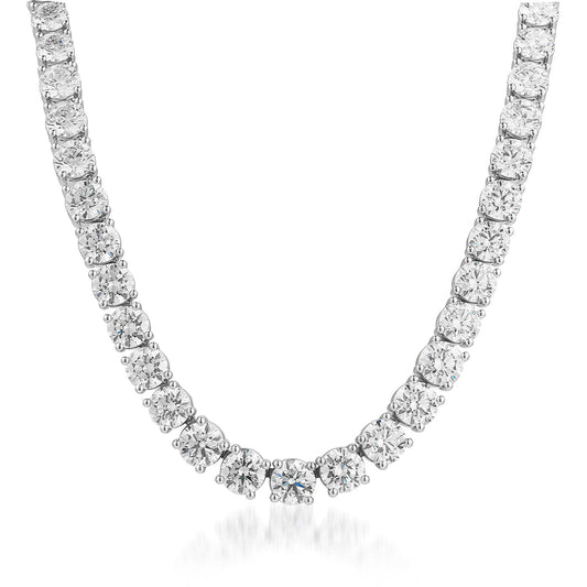 The Raffi&Co.® 18K White Gold Graduated Diamond Necklace features a stunning arrangement of round-cut diamonds, expertly set in a classic prong setting to form an elegant V-shaped design. These GIA-certified diamonds are precisely linked for a continuous shimmering effect, all set in luxurious 18K white gold.