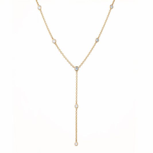 Raffi&Co.® 14K Yellow Gold Lariat Necklace showcases round brilliant diamond accents evenly spaced, featuring an extended drop section on a plain white backdrop.