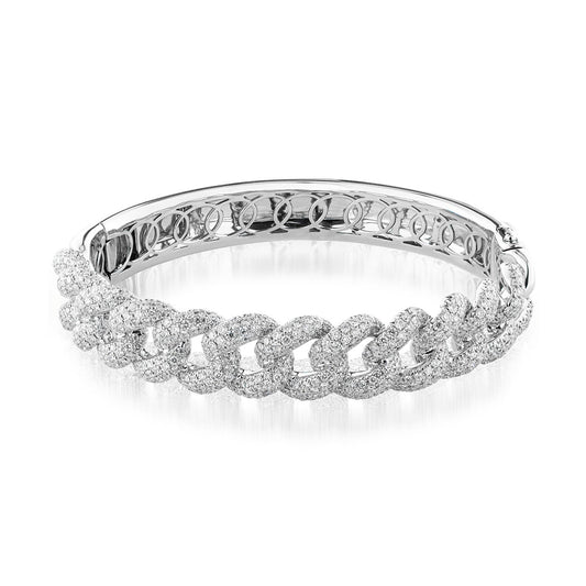 The Raffi&Co.® 18K White Gold Diamond Miami Cuban Bangle exemplifies intricate craftsmanship with a chain-link design adorned with sparkling, pave-set diamonds. Its polished finish enhances its luxurious and elegant appearance.