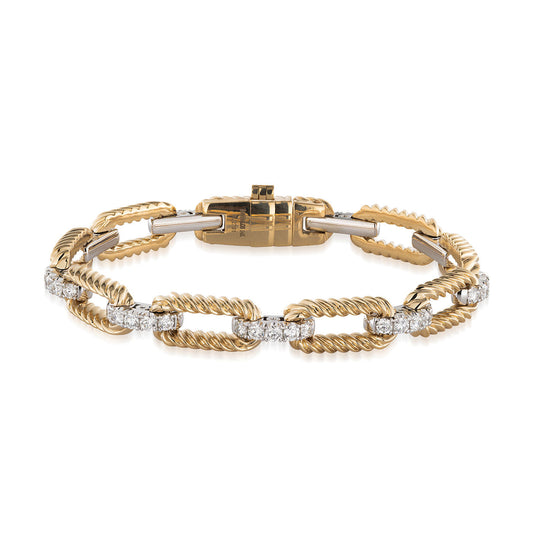 The Raffi&Co.® 14K Yellow and White Gold Diamond Bracelet showcases twisted rope-style links adorned with shimmering diamond-like stones. Its design alternates between textured gold and sleek diamond surfaces, highlighting an intricate clasp, all elegantly presented against a white background.