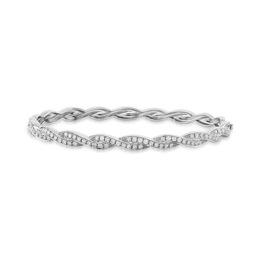 The Raffi&Co® 18K White Gold Diamond Bangle features a luxurious wave pattern with small, sparkling diamonds elegantly set in 18K white gold. Its silver twisted design adds an exquisite touch, effortlessly elevating your style.