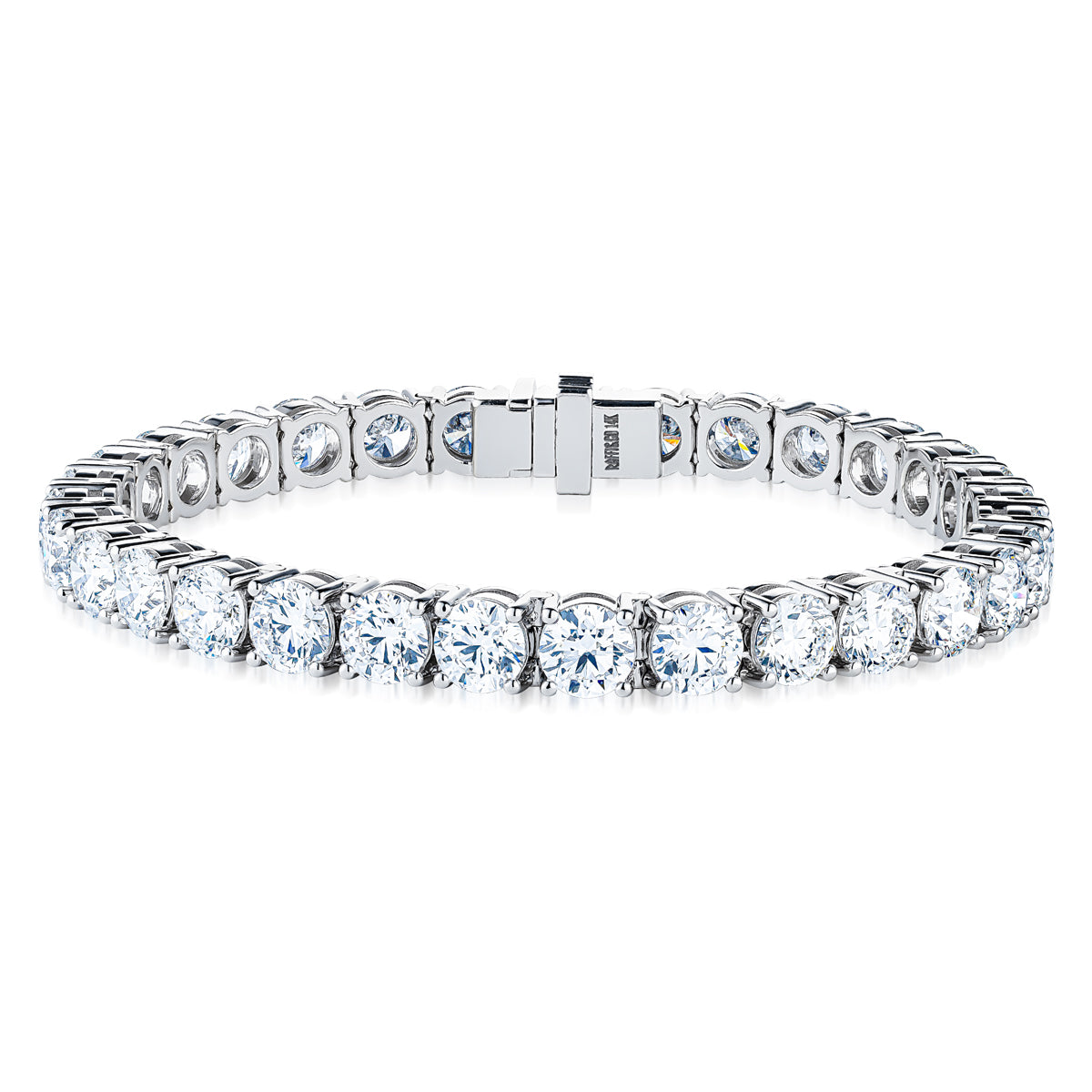 The Raffi&Co.® 14K White Gold Lab Diamond Bracelet showcases a seamless array of round, sparkling diamonds nestled in individual prong settings. It features a secure clasp and a polished finish that enhances the brilliance of the gemstones.