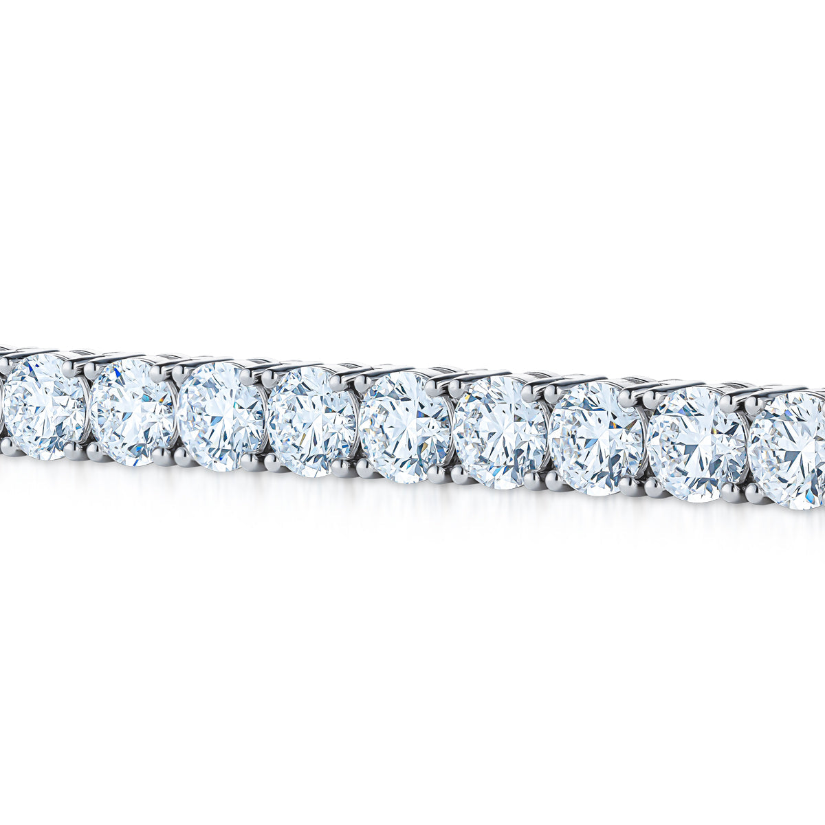 Close-up of the Raffi&Co.® 14K White Gold Lab Diamond Bracelet featuring round cut lab diamonds set in a sleek white gold band, arranged in a single line against a white background.