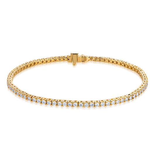 The Raffi&Co.® 14K Yellow Gold Round Brilliant Lab Diamond Tennis Bracelet features a single row of lab-grown round diamonds in a delicate gold band, embodying sustainable luxury. Displayed on a white background.