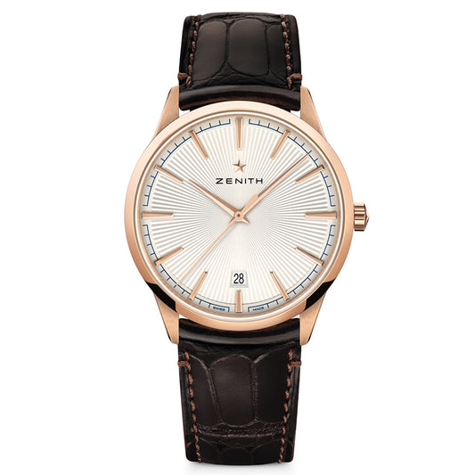 The ZENITH Elite Classic 670 watch radiates elegance with its 18k rose gold-tone case, ultra-thin design, and white dial featuring minimalist markers and a date window at 6 o'clock. The refined brown leather strap with a textured pattern completes this luxurious Zenith timepiece.