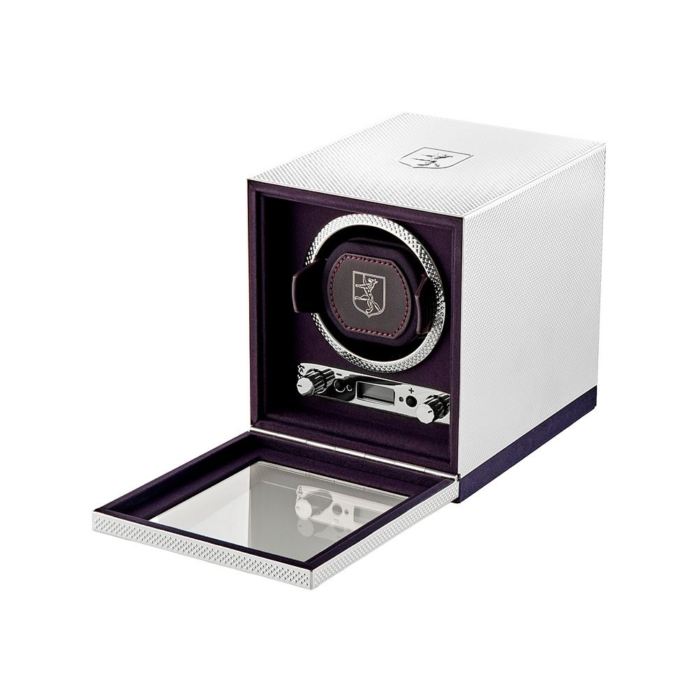 The WOLF 1834 Single Watch Winder Silver by WOLF features a sleek, box-shaped white design with an open glass front door, showcasing a single watch holder accented with black and silver details—an ideal luxury accessory for elegantly displaying and maintaining your timepiece.