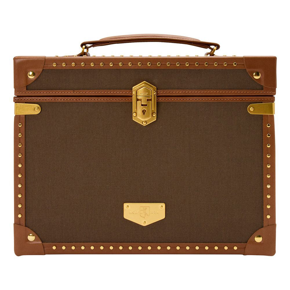 Introducing the WOLF 1834 Ida Trunk Jewellery Box, a vintage-inspired brown and tan trunk adorned with brass stud detailing. It boasts a stylish leather handle on top and an exclusive custom-designed lock at its center, enhanced by decorative corner protectors for added elegance.