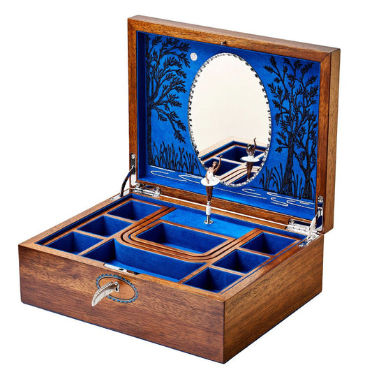 Commemorate WOLF's 190th anniversary with the exquisite WOLF 1834 Ballet Musical Jewellery Box. Featuring a wooden exterior and a blue velvet-lined interior, this box includes compartments for organization and a charming ballerina figurine that dances to Swan Lake. When you open the lid, you'll discover a circular mirror set against a beautifully designed artistic landscape in blue.