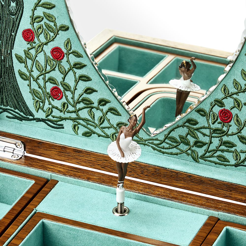 The WOLF 1834 Ballet Musical Jewellery Box - Sleeping Beauty features walnut wood, a light blue velvet lining, embroidered roses, and a mirrored lid reflecting a white tutu ballerina figurine on a rotating platform.