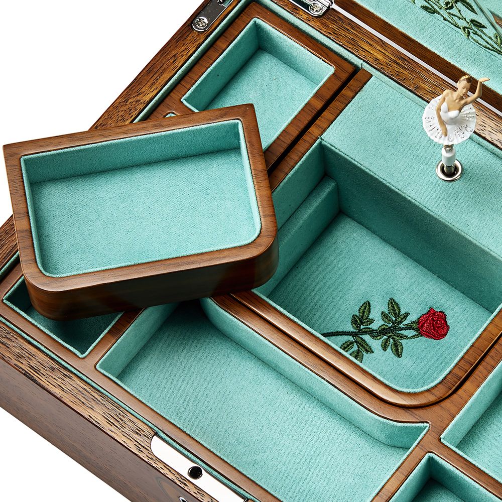 The WOLF 1834 Ballet Musical Jewellery Box - Sleeping Beauty in walnut wood by WOLF features multiple compartments, teal velvet lining, a red rose embroidery, and a graceful ballerina figurine.