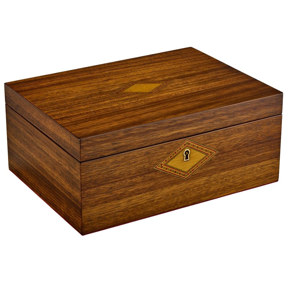 A walnut WOLF 1834 Nutcracker musical jewelry box with a polished finish, featuring a diamond-shaped inlay and a keyhole on the front.