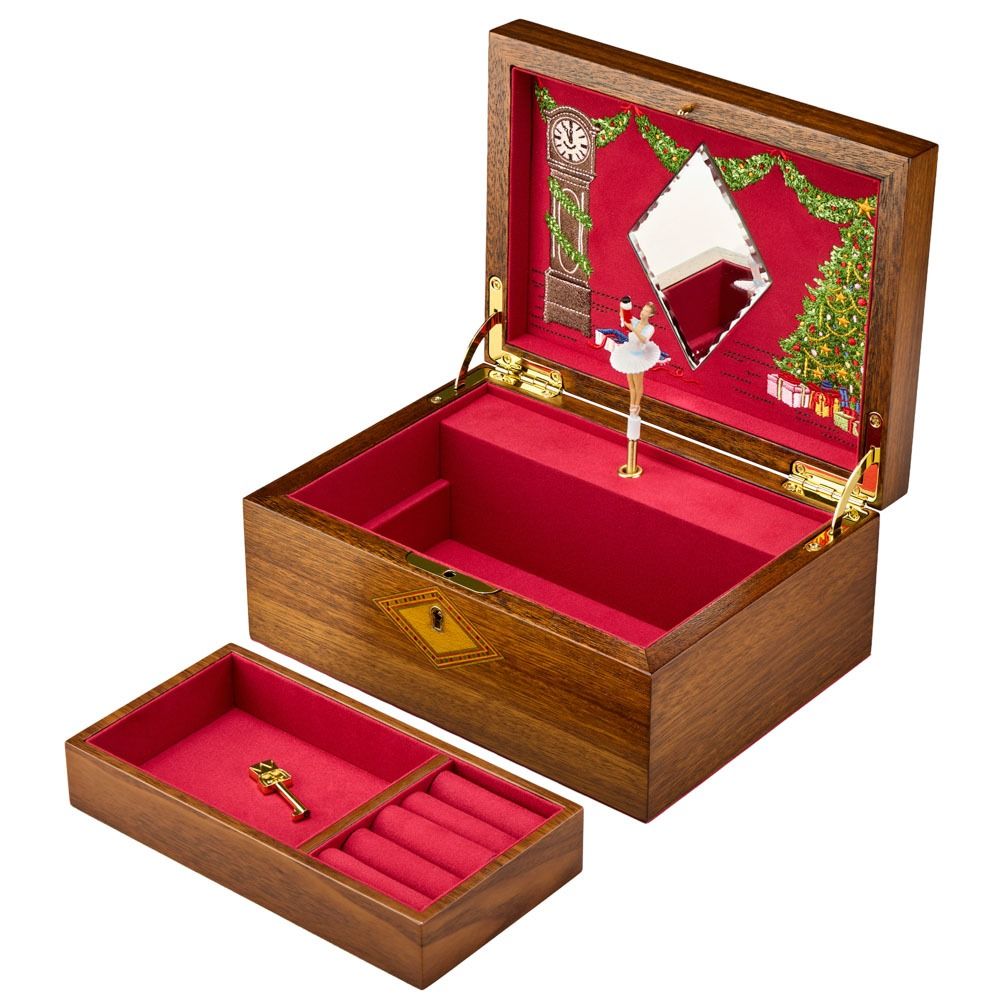 WOLF 1834 Nutcracker Musical Box Jewelry Box in walnut, featuring a red velvet interior, ballerina figurine in front of a mirror, Christmas tree and clock inside the lid. Includes a removable tray with key, placed outside the box.