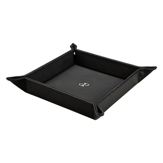 The WOLF 1834 Philipp Snap Valet Tray by WOLF features raised edges, corner snaps, and a white minimalist logo at the center of its black base, offering expertly crafted, stylish organization.
