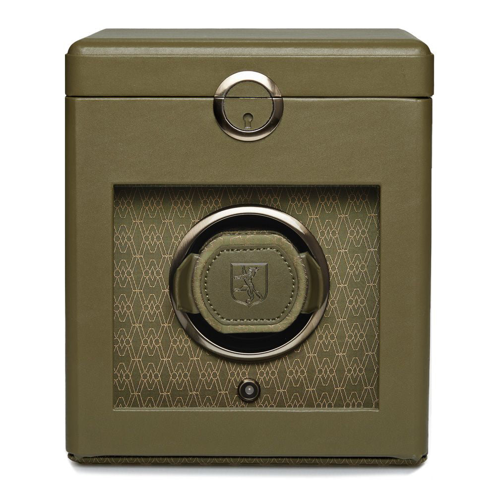 Introducing the WOLF 1834 Earth Single Watch Winder by WOLF, featuring a stunning green, cube-shaped design. This Bluetooth-enabled watch winder boasts a transparent front panel adorned with an intricate geometric pattern and includes a rotating mechanism tailored for one watch. It offers various rotation settings and comes equipped with a keyhole at the top center for enhanced security.