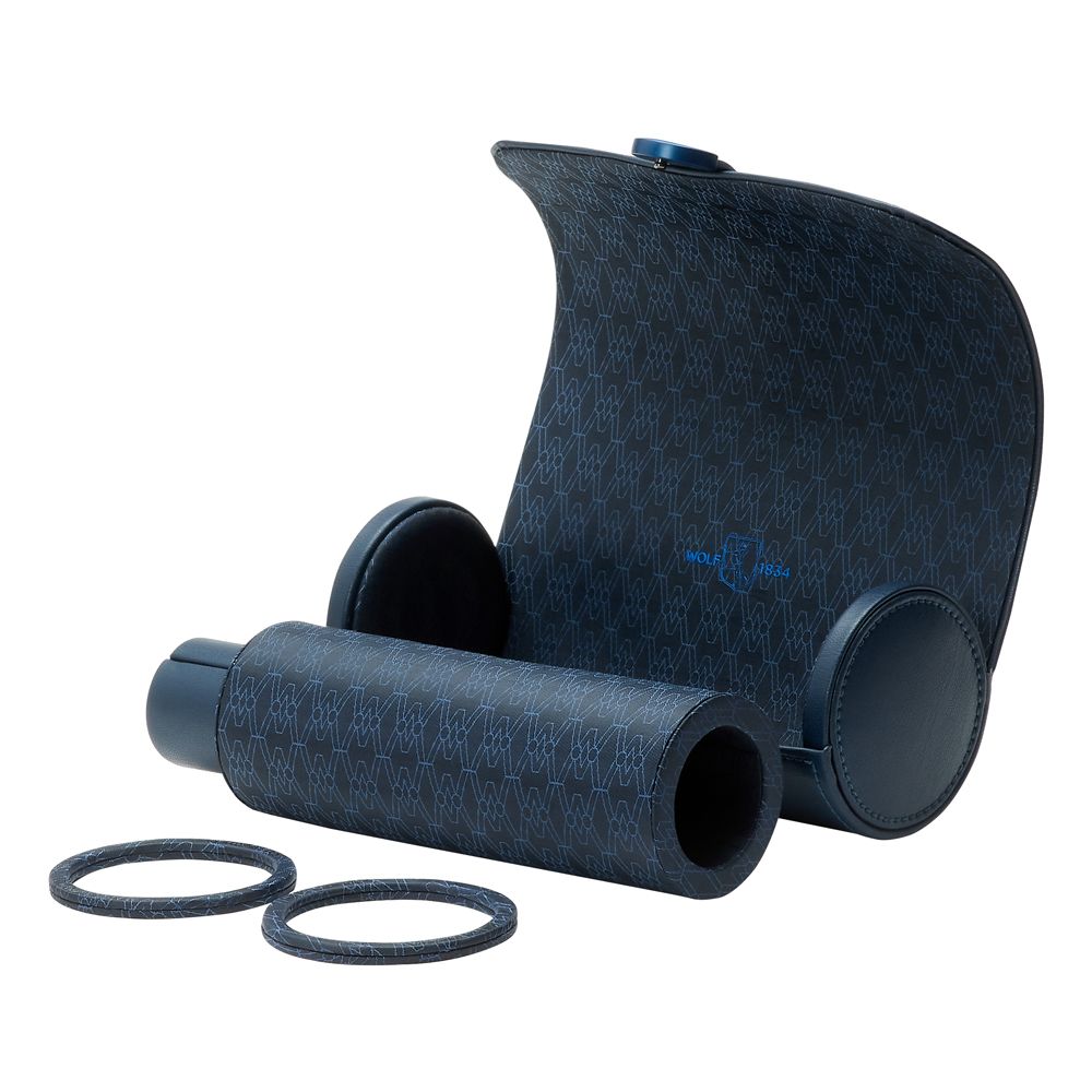 The WOLF 1834 Earth Triple Watch Roll by WOLF is shown open, revealing its stylish curved case with a subtle repeating logo design alongside two extra refills—crafted from eco-friendly materials in dark blue with a patterned handle.