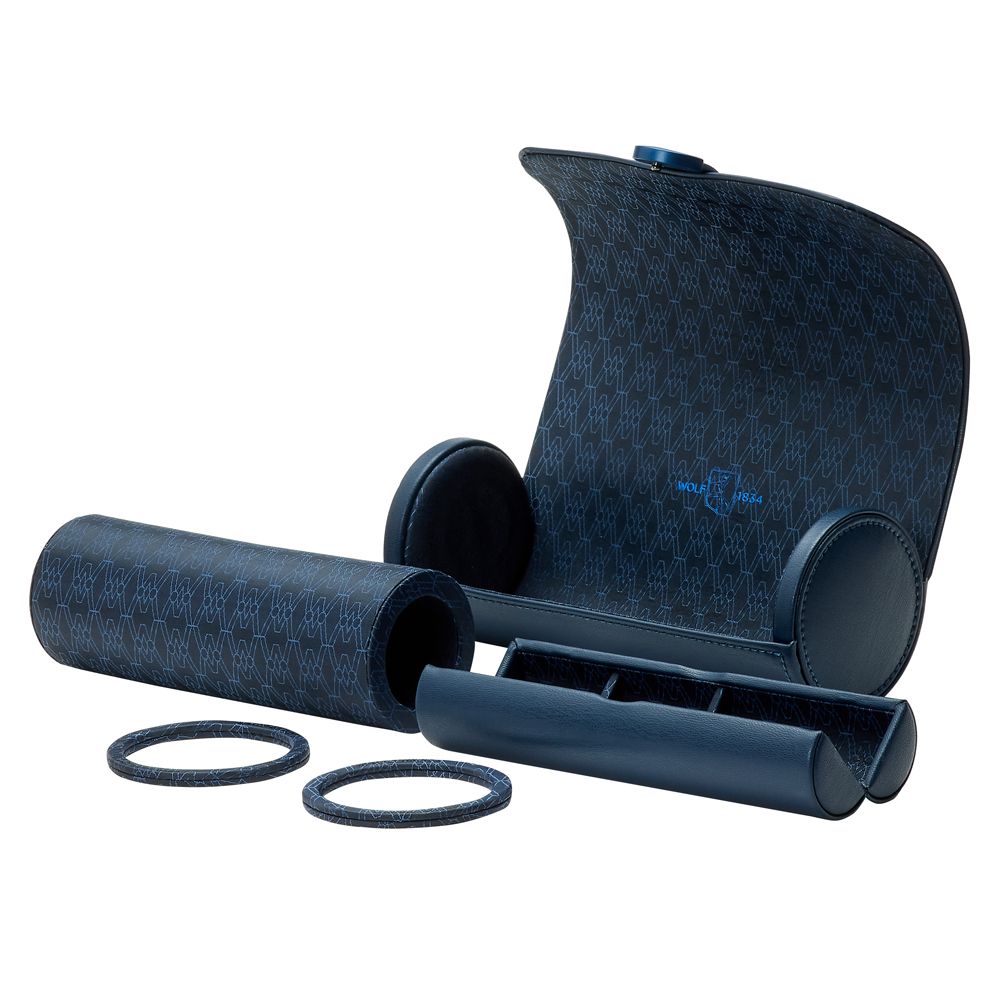 The WOLF 1834 Earth Triple Watch Roll by WOLF is shown open with two matching tube containers and two round rings beside it. Its blue, patterned apple leather interior has compartments, and the lid features a geometric design.