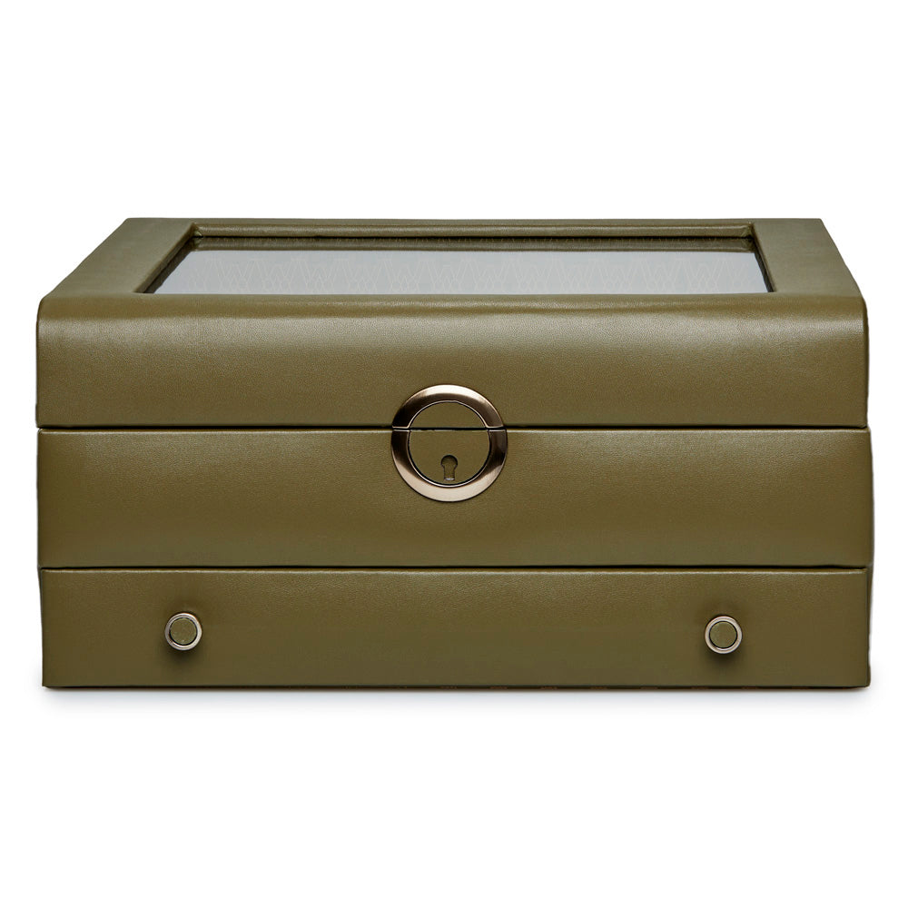 Introducing the WOLF 1834 Earth Watch Stand Box - a limited edition offering by WOLF. This elegant green leather jewelry box comes with a transparent top panel that is ideal for watch storage. It features a distinctive round silver locking mechanism in the center, along with two metallic knobs on the front for convenient access, making it an exceptional choice for sophisticated packaging.