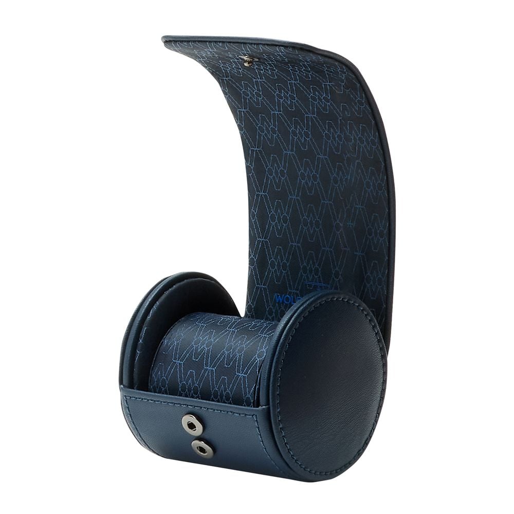 The WOLF 1834 Earth Single Watch Roll by WOLF features dark blue apple leather, a cylindrical shape, recycled satin interior, an upright open lid, and two snap buttons on the front for storing one watch.