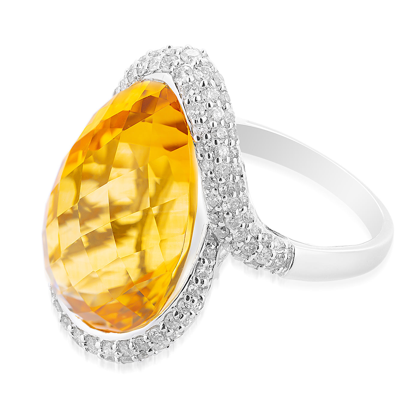 The Pear Citrine Ring by Raffi&Co.® features a large faceted yellow gemstone set in 14K white gold, surrounded by small clear gems. The elegant and intricate design captures attention with its exquisite detailing.