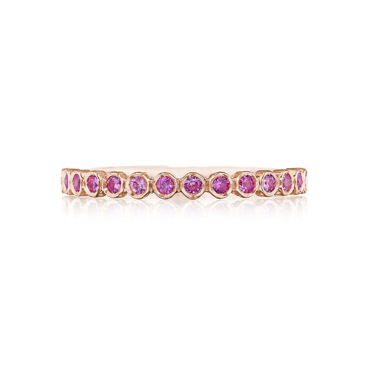 The Tacori Sculpted Crescent 18K Rose Gold Round Brilliant Bezel Droplet Pink Sapphire Anniversary Ring features a design with pink sapphires evenly spaced around the band, creating an elegant and symmetrical style reminiscent of the iconic Tacori aesthetic.