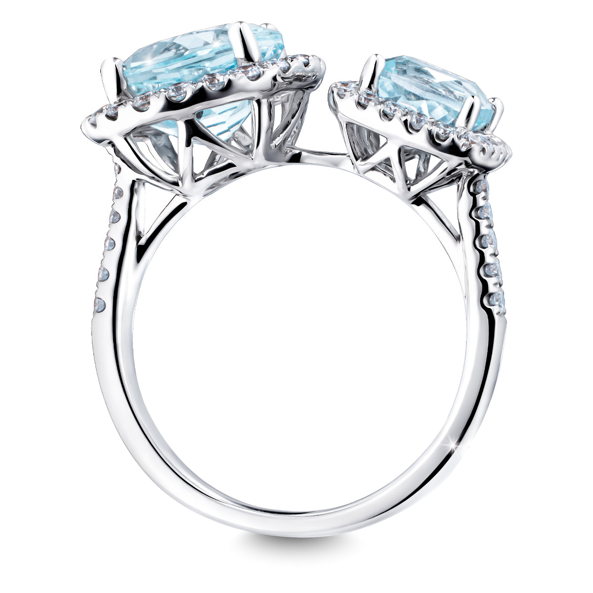 The Raffi&Co.® 18K White Gold Round Blue Topaz with Diamond Fashion Ring showcases two large, light blue topazes in prong settings, adorned with small diamonds along the band and intricate metalwork beneath the gemstones.