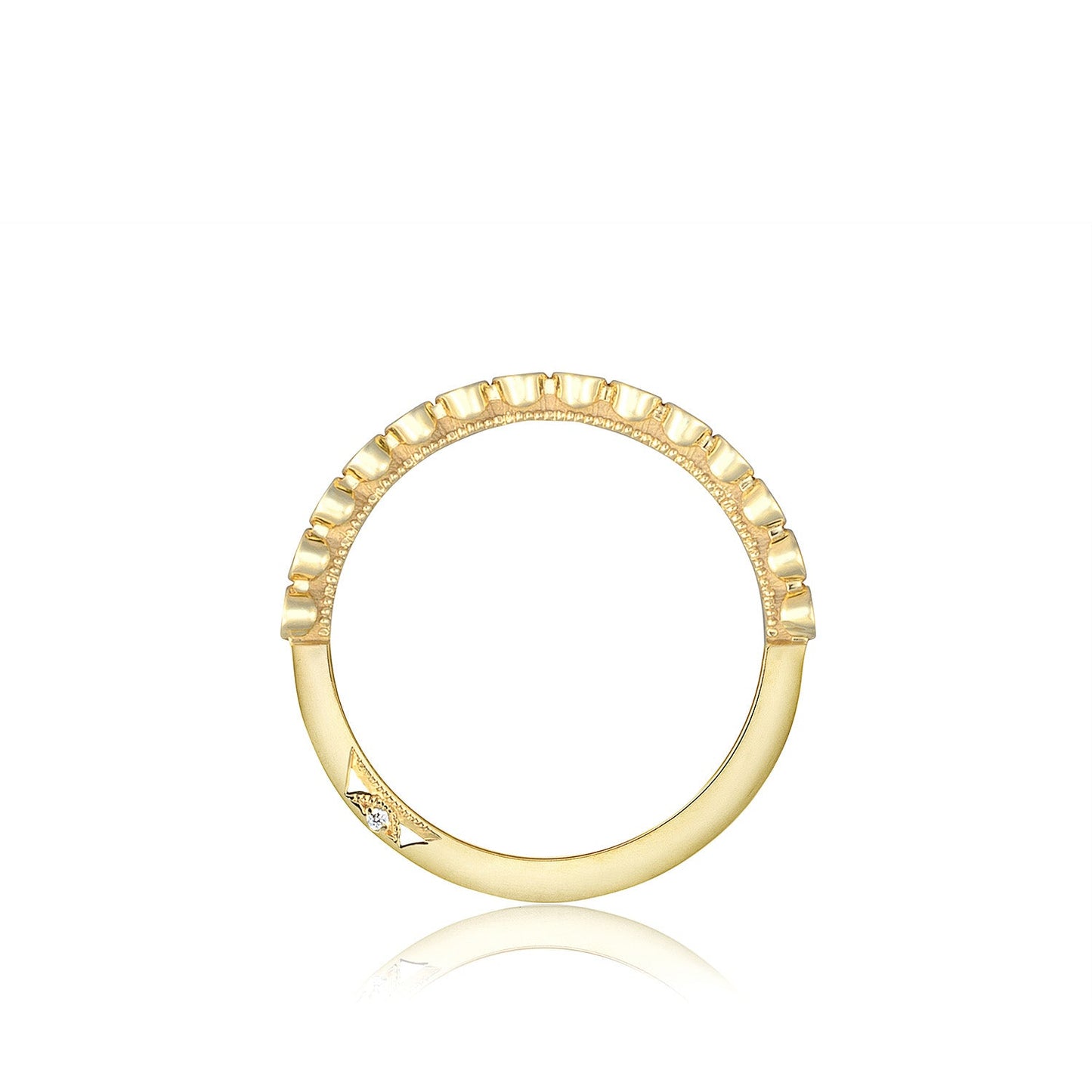 The Tacori Sculpted Crescent 18K Yellow Gold Round Brilliant Bezel Droplet Diamond Anniversary Ring showcases a geometric design with small ridges along the top half and a diamond-accented arrow shape on one side, echoing the distinctive style of Sculpted Crescent fabric by Tacori, set against a white background.