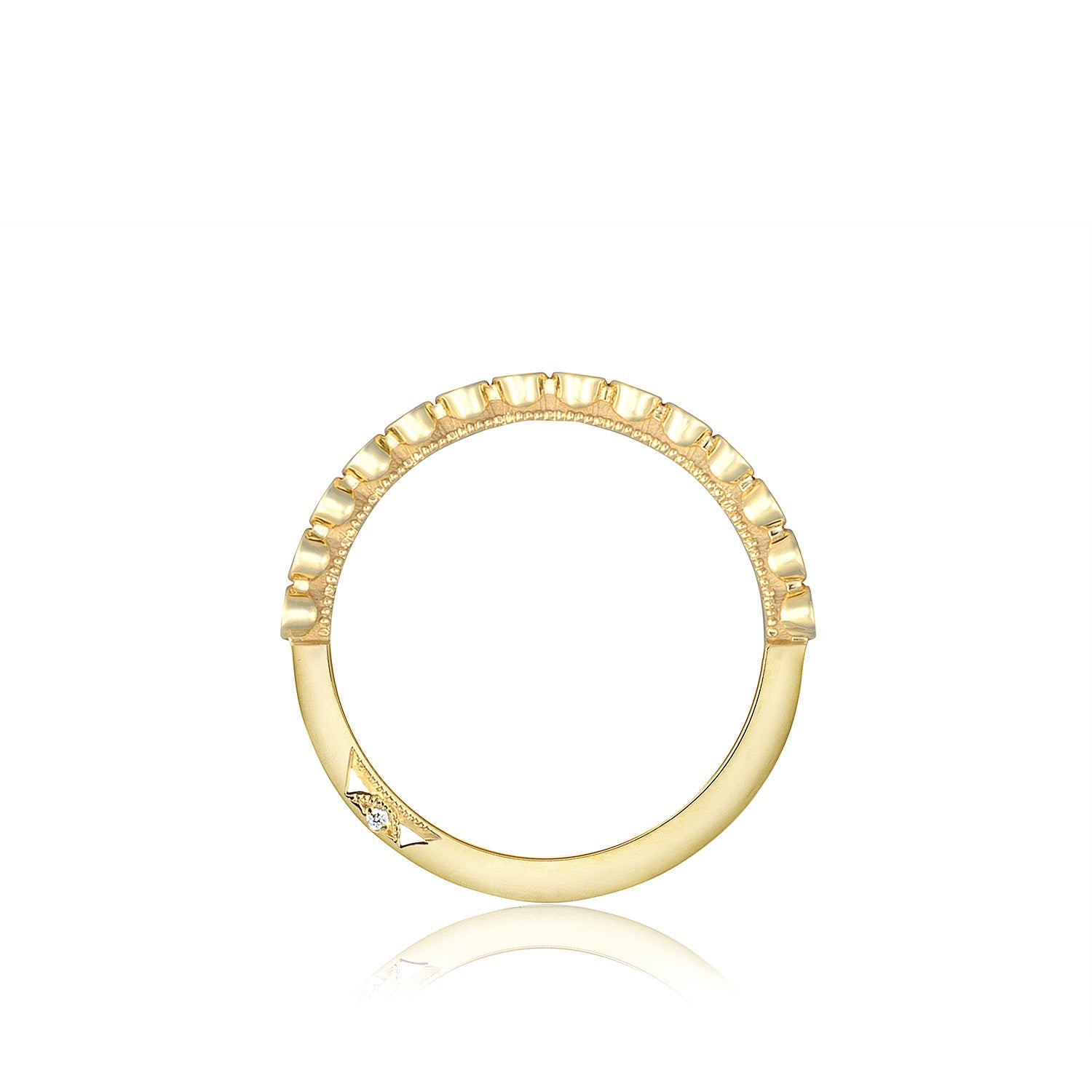The Tacori Sculpted Crescent 18K Yellow Gold Round Brilliant Bezel Droplet Diamond Anniversary Ring showcases a geometric design with small ridges along the top half and a diamond-accented arrow shape on one side, echoing the distinctive style of Sculpted Crescent fabric by Tacori, set against a white background.