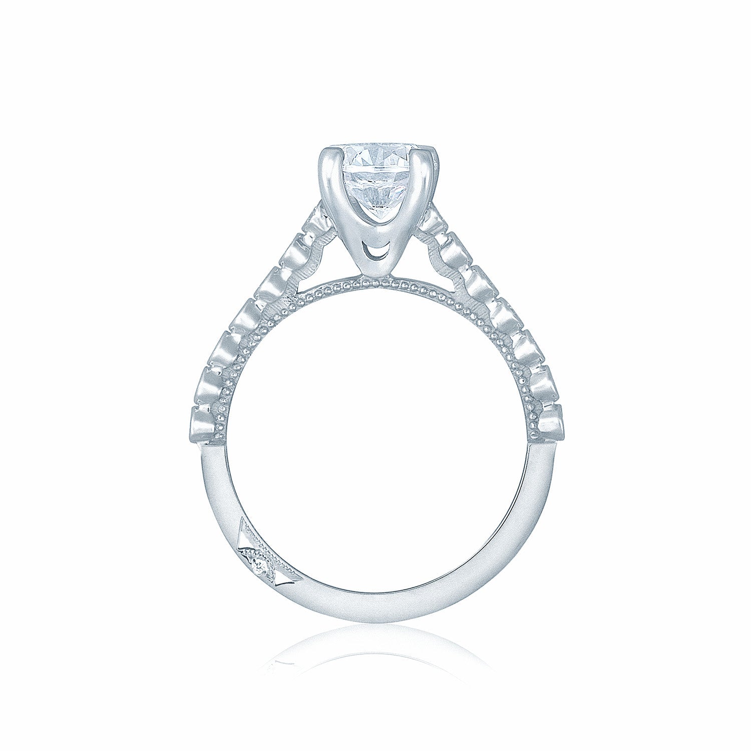 This Tacori Sculpted Crescent engagement ring features a clear round brilliant diamond set in an 18K white gold band, enhanced with intricate details and small embedded diamonds for an elegant and delicate design. The white background accentuates the ring's expert craftsmanship.