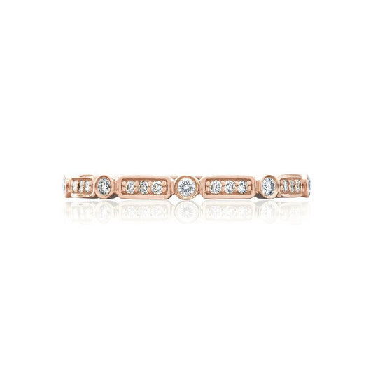 The Tacori Sculpted Crescent 18K Rose Gold Round Brilliant Bezel Droplet Diamond Anniversary Ring by Tacori features a series of round diamonds set in bezels, beautifully spaced along the band. Its symmetrical design exudes charm, with reflections shimmering against a white background, making it an ideal choice for those seeking unique engagement rings.