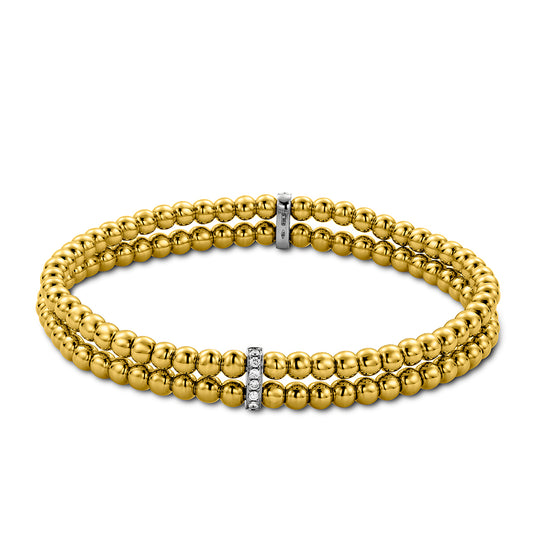 The Hulchi Belluni Tresore 18K Yellow Gold Diamond Bracelet features double strands with polished gold beads and two silver spacers set with 0.20 CTW round brilliant diamonds for a sleek, elegant look.