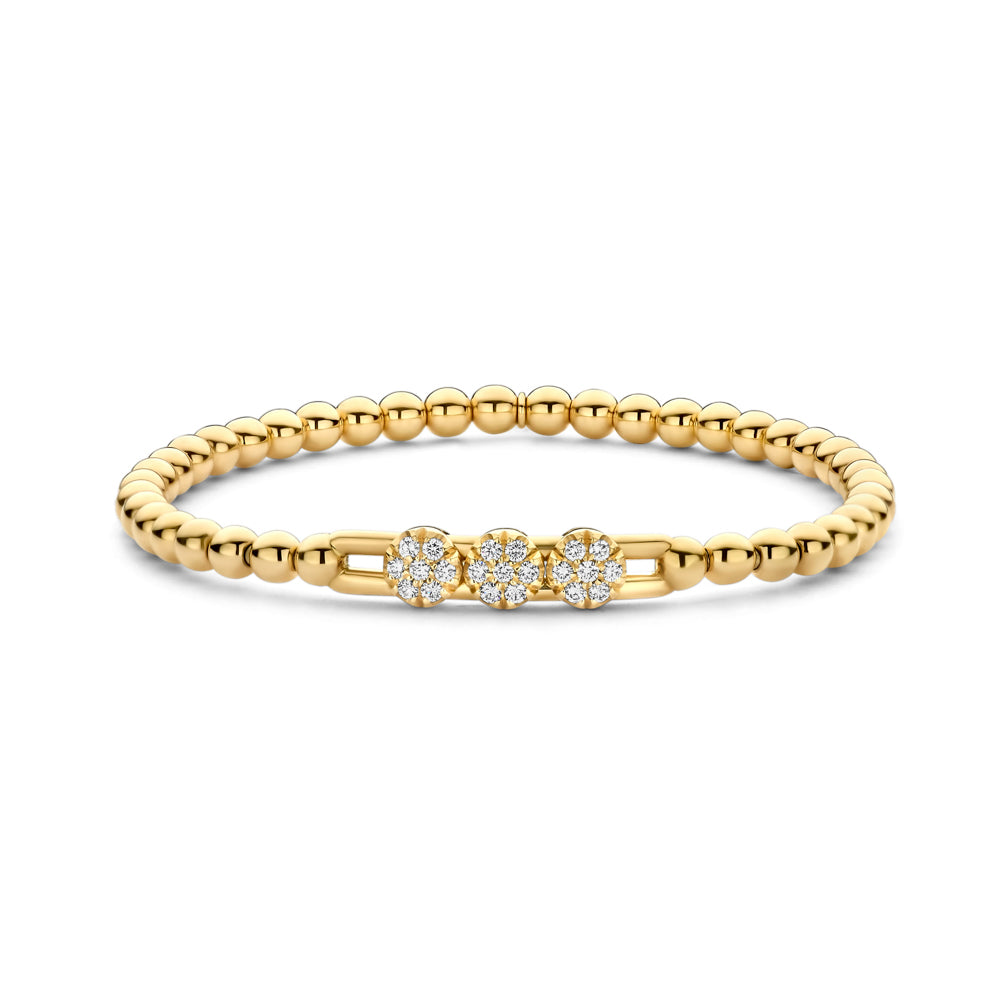 The Hulchi Belluni 18K Yellow Gold Diamond Bracelet features three round diamond clusters totaling 0.30 CTW, elegantly set in a delicate beaded design.