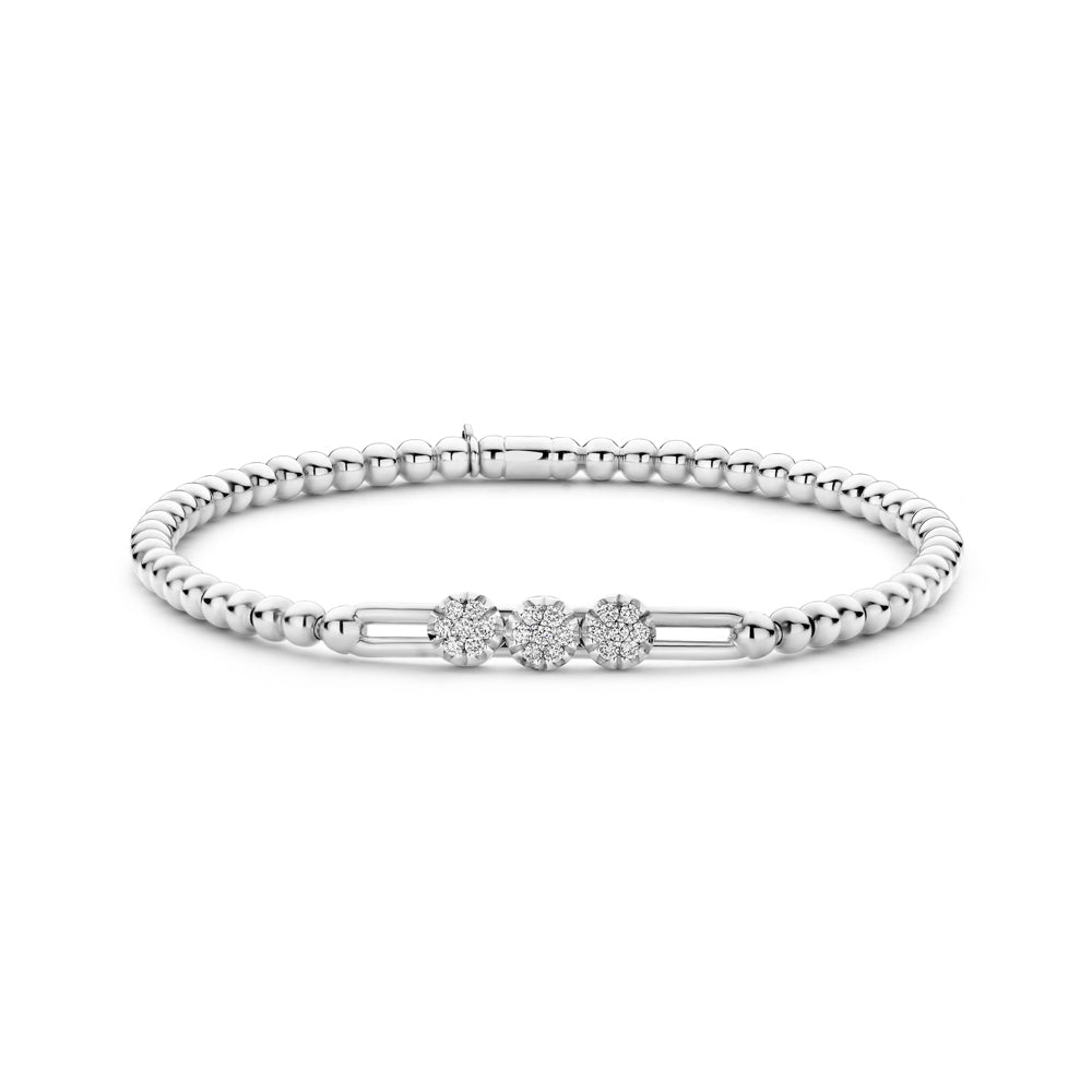 The Hulchi Belluni 18K White Gold Diamond Bracelet features a beaded silver band with three clustered round diamond flower motifs totaling 0.19 CTW, shown on a white background.