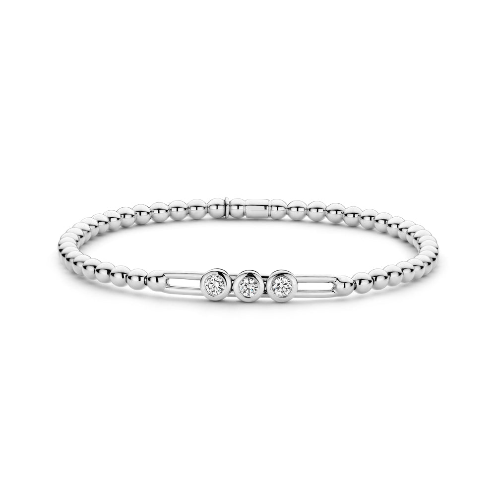 The Hulchi Belluni Tresore 18K White Gold Diamond Stretch Bracelet features three round brilliant diamonds (0.28 CTW) bezel-set in a row, linked by slim bars, with a silver beaded design.
