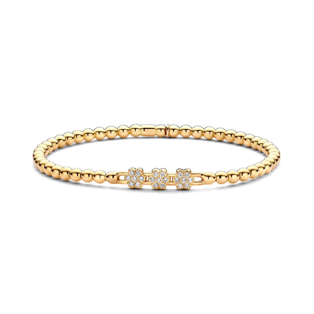 The Hulchi Belluni 18K Yellow Gold Diamond Bracelet features three flower clusters with 0.22 CTW round brilliant diamonds, all set in gold beads and displayed on a white background.