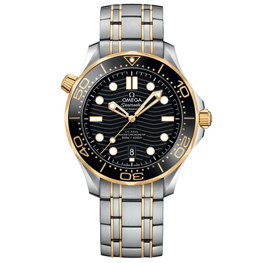The OMEGA Seamaster Diver 300M Co-Axial Master Chronometer 42mm Watch is a silver and gold timepiece featuring a black wavy-patterned dial with luminescent hands and markers. It includes a ceramic rotating bezel, complemented by a stainless steel and gold strap, powered by the Master Chronometer Calibre 8800 movement, and has a date window at the 6 o'clock position.