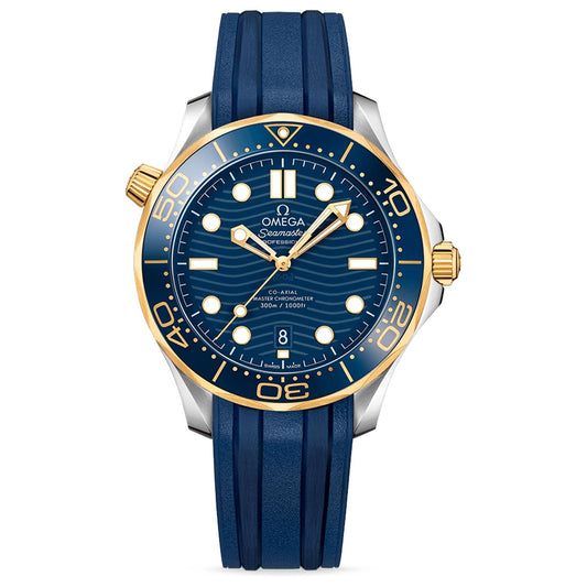 The OMEGA Seamaster Diver 300M Co-Axial Master Chronometer 42mm Watch is a luxury timepiece featuring a blue ceramic bezel and dial, adorned with luminous markers. It comes with a blue rubber strap and has a gold crown. The dial showcases the Seamaster Professional Diver logo and includes a date window at the 6 o'clock position.