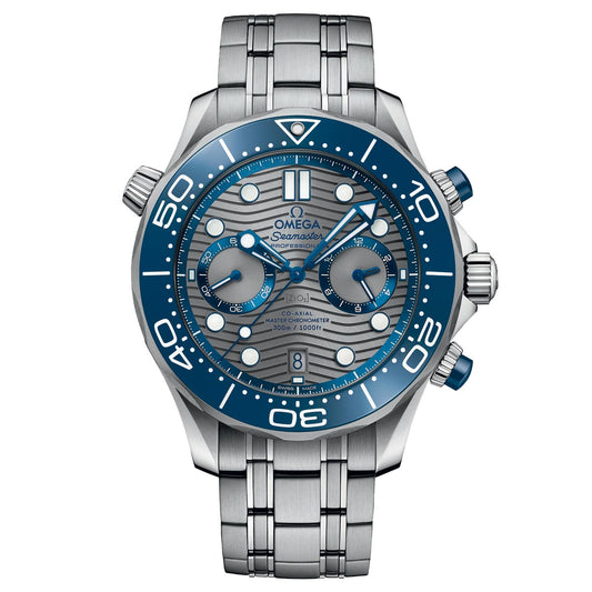 The OMEGA Seamaster Diver 300M Co-Axial Master Chronometer Chronograph 44mm Watch presents a silver stainless steel bracelet complemented by an eye-catching blue bezel and dial. It is powered by the Master Chronometer Calibre 9900, featuring white hour markers, three subdials, and blue pushers. This watch is water-resistant up to 300 meters.